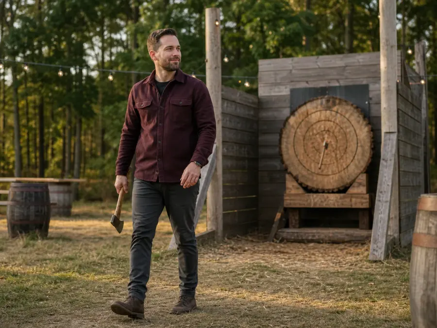 Competitor throwing an axe at an outdoor target