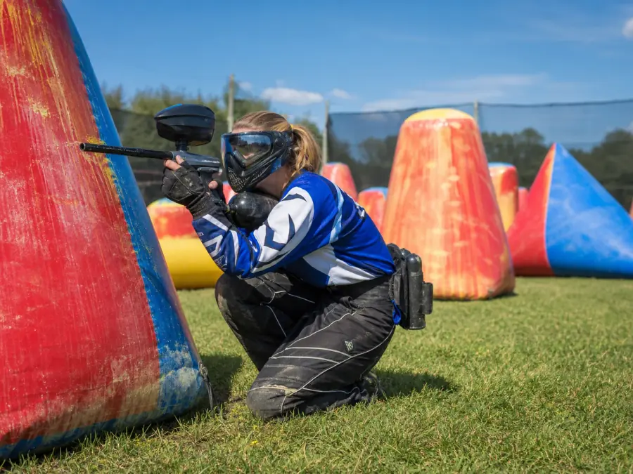 Outdoor paintball field laid out with cover and barricades